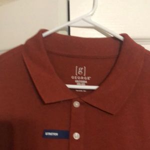 Short sleeve polo shirt. Never been worn. Smoke free environment.